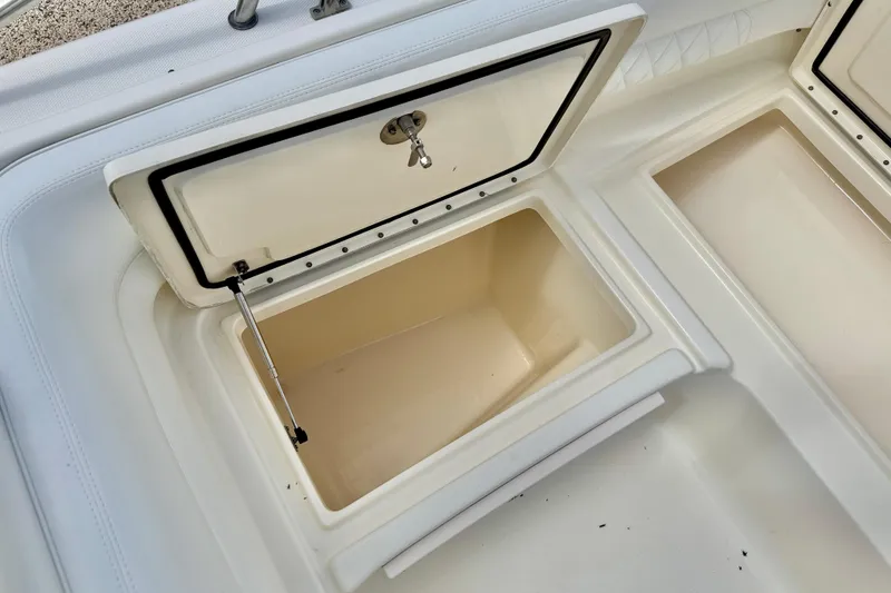 Slide: The Image of Open storage compartment on a 2007 World Cat 250 DC boat, showcasing interior space. - 31