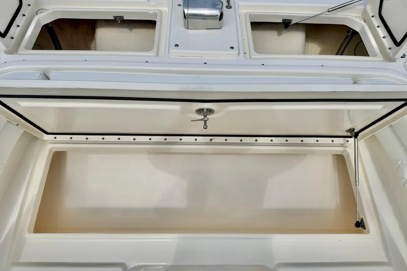 Slide: The Image of Open storage compartment on a 2007 World Cat 250 DC boat, showcasing ample space. - 32