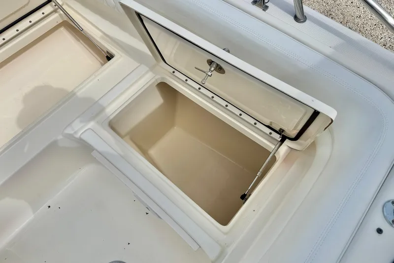 Slide: The Image of Open storage compartment on a 2007 World Cat 250 DC boat. - 33