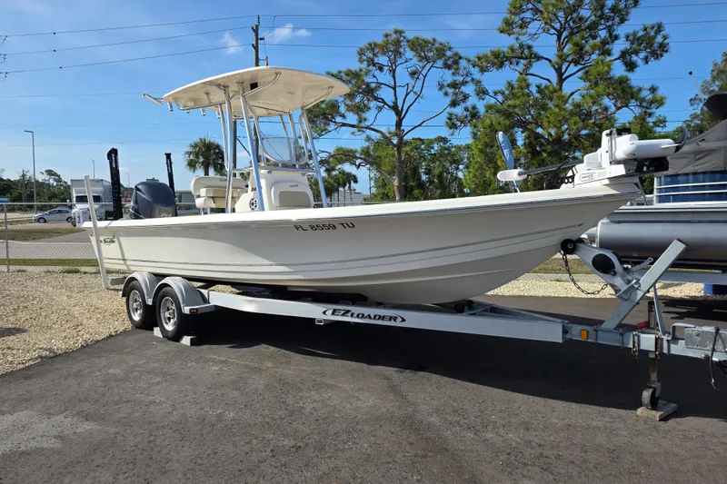 The Image of 2023 Bulls Bay 2400 boat on trailer, parked outdoors under clear blue sky. - 1