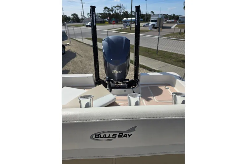 Slide: The Image of 2023 Bulls Bay 2400 boat with powerful engine, docked outdoors. - 10