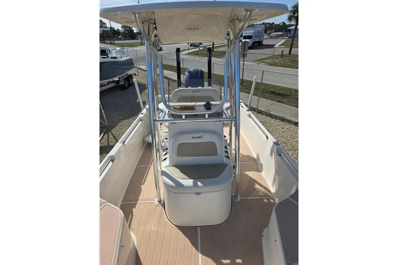 Slide: The Image of 2023 Bulls Bay 2400 boat interior with seating and steering console. - 6