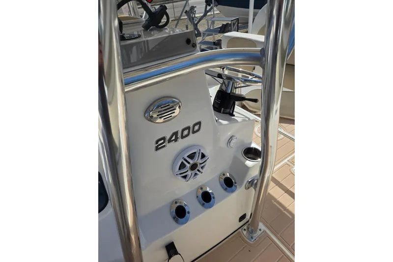 Slide: The Image of 2023 Bulls Bay 2400 boat console with steering wheel and speaker. - 8