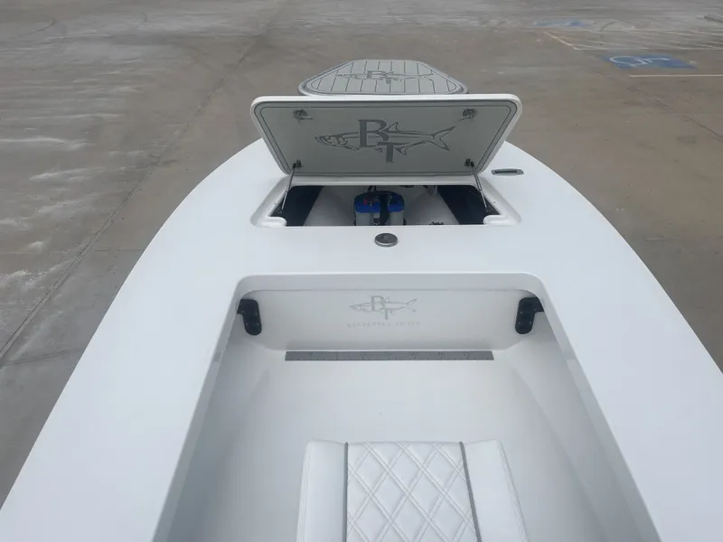 Slide: The Image of 2024 Beavertail Strike 17 boat with open storage compartment lid. - 13