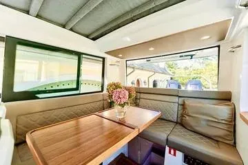Slide: The Image of Luxurious interior of 2018 Axopar 37 XC CROSS CABIN with elegant seating and wooden table. - 24