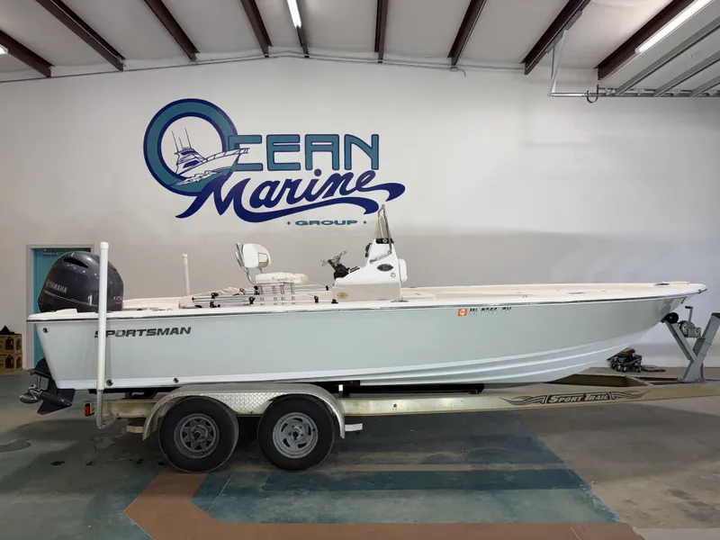 The Image of 2015 Sportsman Masters 227 Bay Boat on trailer in warehouse. - 1