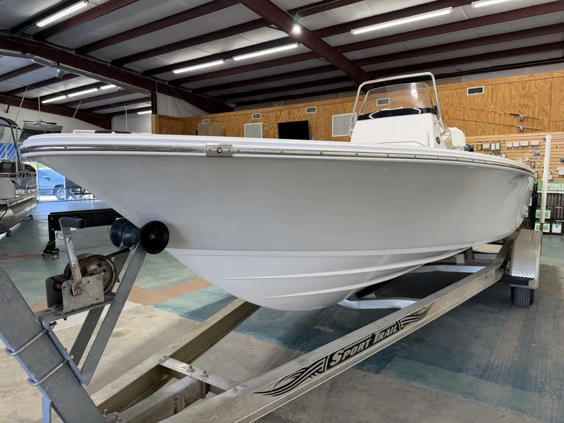 Slide: The Image of 2015 Sportsman Masters 227 Bay Boat on trailer in warehouse. - 11