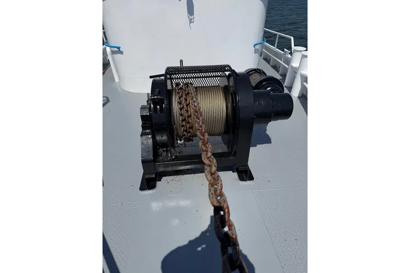 Slide: The Image of 1954 American 70 Tug winch with chain on deck. - 10