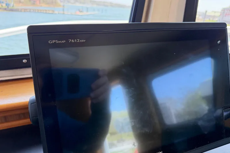 Slide: The Image of GPSMAP 7612xsv device on 1954 American 70 Tugboat, with water view in background. - 40