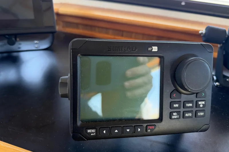 Slide: The Image of Simrad AP60 marine autopilot control on a 1954 American 70 Tugboat dashboard. - 41