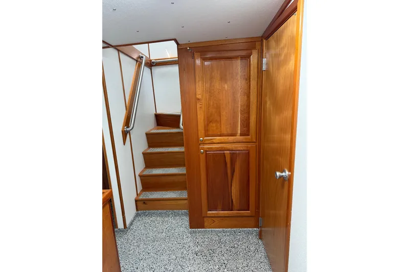 Slide: The Image of Interior of 1954 American 70 Tug with wooden stairs and door. - 59