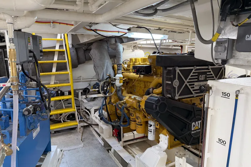 Slide: The Image of Engine room of a 1954 American 70 Tugboat featuring a CAT marine engine. - 60