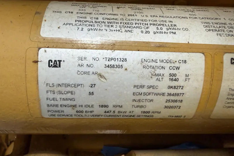 Slide: The Image of Label on CAT C18 engine, showing specifications and serial number details. - 62