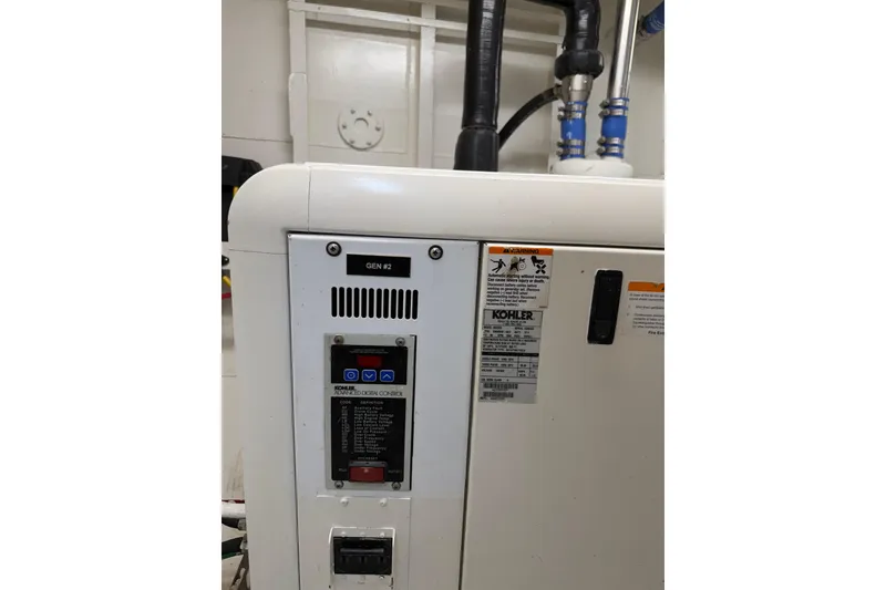 Slide: The Image of Industrial generator control panel on a 1954 American 70 Tug, featuring Kohler branding. - 66
