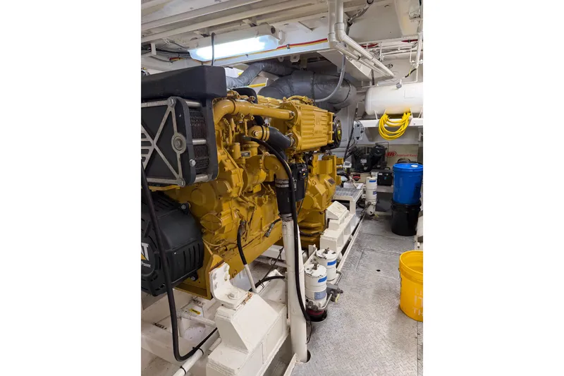 Slide: The Image of Engine room of a 1954 American 70 Tugboat with visible machinery and equipment. - 68