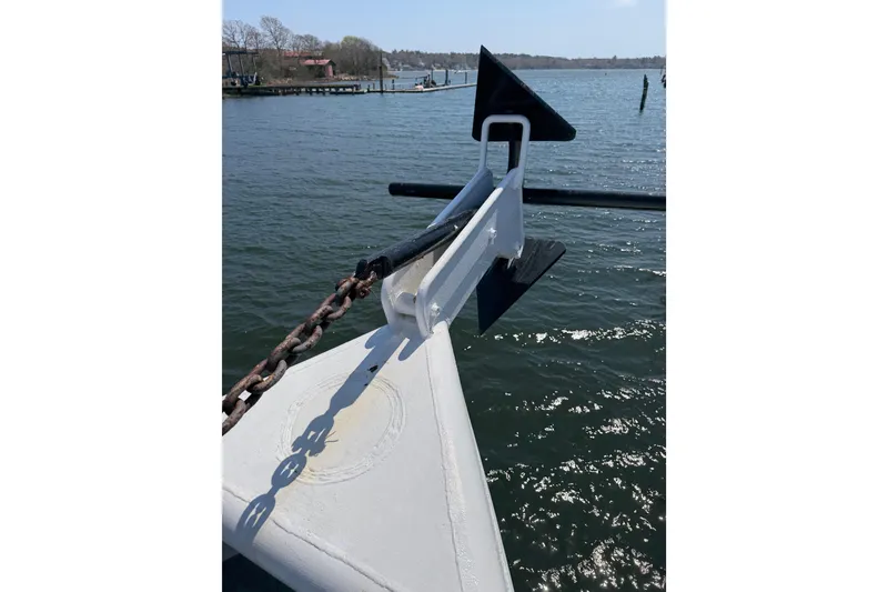 Slide: The Image of Bow of a 1954 American 70 Tugboat with anchor chain over water. - 9