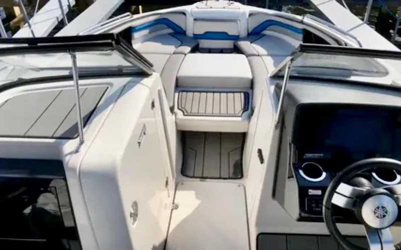 Slide: The Image of 2019 Yamaha Boats 242X E-Series interior with modern dashboard and seating. - 10