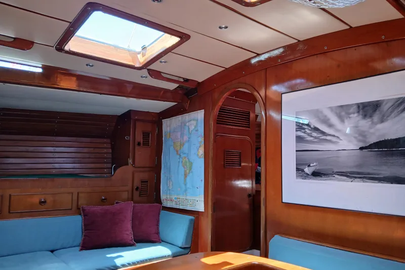 Slide: The Image of Interior of 1981 SKYE 51 yacht with wooden paneling and nautical decor. - 17