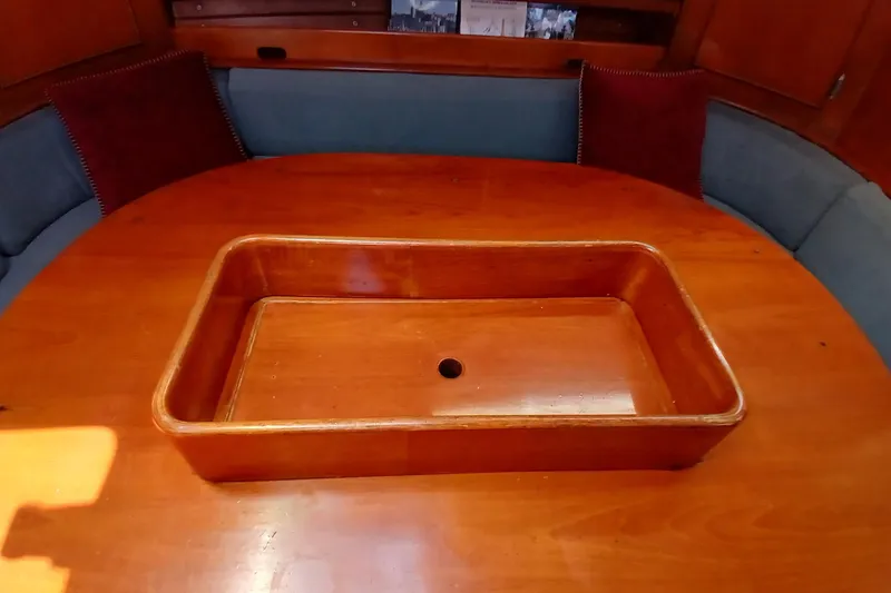 Slide: The Image of Wooden table with built-in tray on a 1981 SKYE 51 yacht interior. - 24