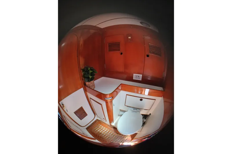 Slide: The Image of 1981 SKYE 51 yacht bathroom with wooden cabinetry and white fixtures. - 41