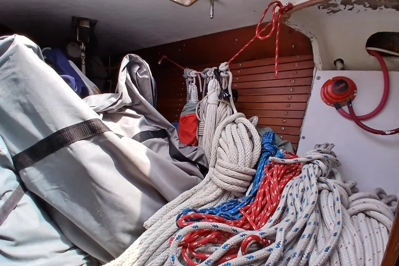 Slide: The Image of Interior of 1981 SKYE 51 sailboat with ropes and gear storage. - 45