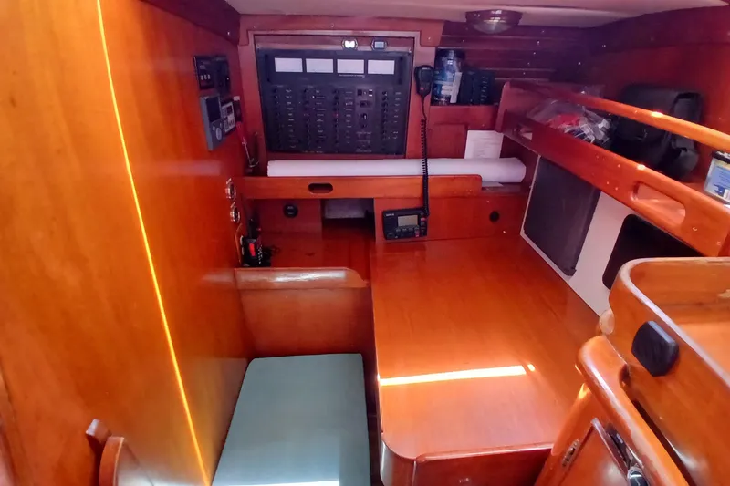 Slide: The Image of Interior of 1981 SKYE 51 yacht with navigation station and wooden furnishings. - 52