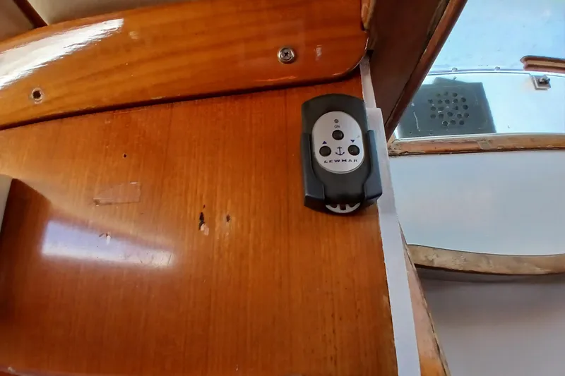 Slide: The Image of Control panel on wooden interior of 1981 SKYE 51 boat. - 53