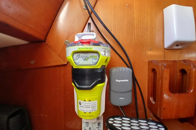 Slide: The Image of Emergency beacon and Raymarine device on 1981 SKYE 51 yacht's wooden interior. - 56
