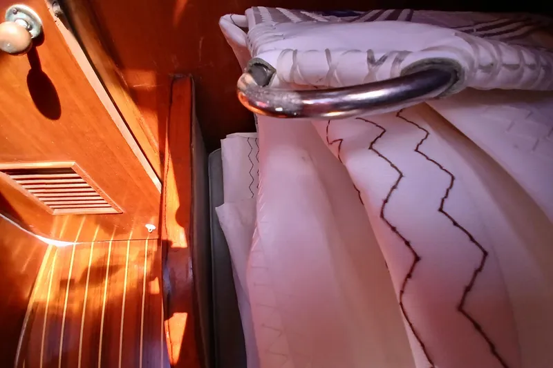 Slide: The Image of Interior of 1981 Kaufman Skye 51 yacht with wooden paneling and patterned fabric. - 60
