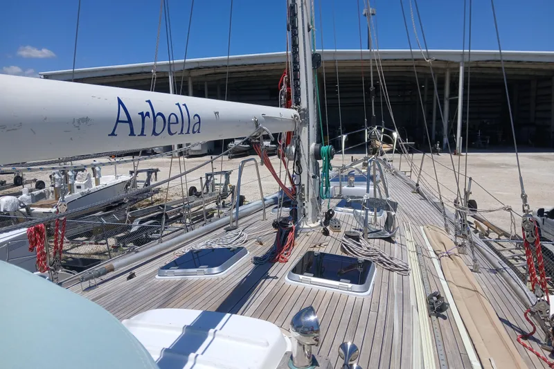 Slide: The Image of Sailboat deck view of 1981 Kaufman Skye 51, named "Arbella," in a marina setting. - 63