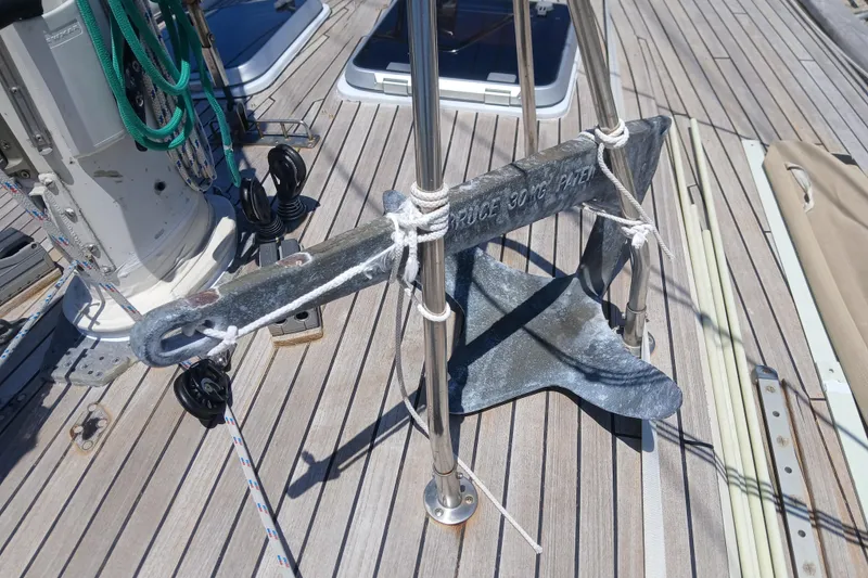 Slide: The Image of Anchor on deck of 1981 Kaufman Skye 51 sailboat, secured with ropes. - 65