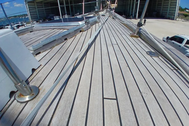 Slide: The Image of Deck view of 1981 Kaufman Skye 51 sailboat in a marina setting. - 67