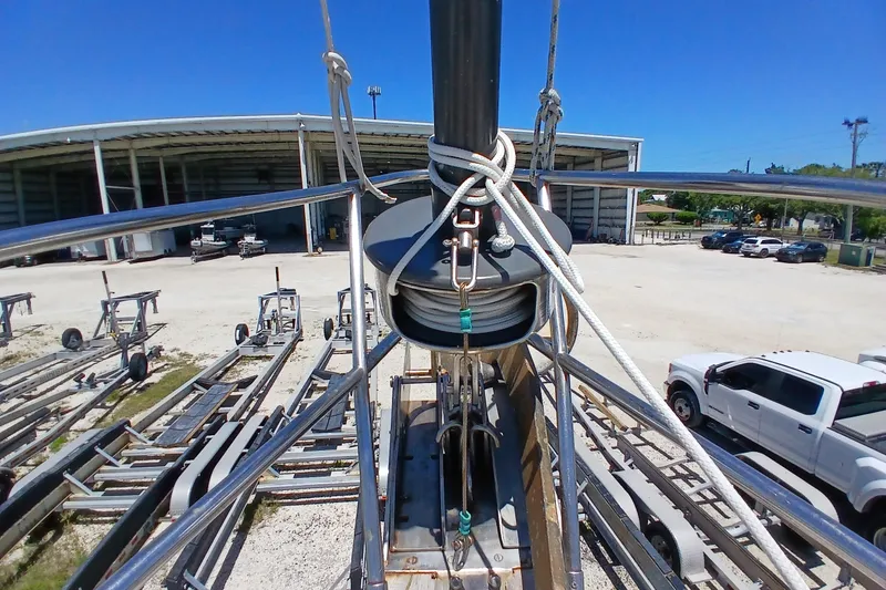 Slide: The Image of View from Kaufman Skye 51 sailboat mast, showing rigging and boatyard with trailers. - 70