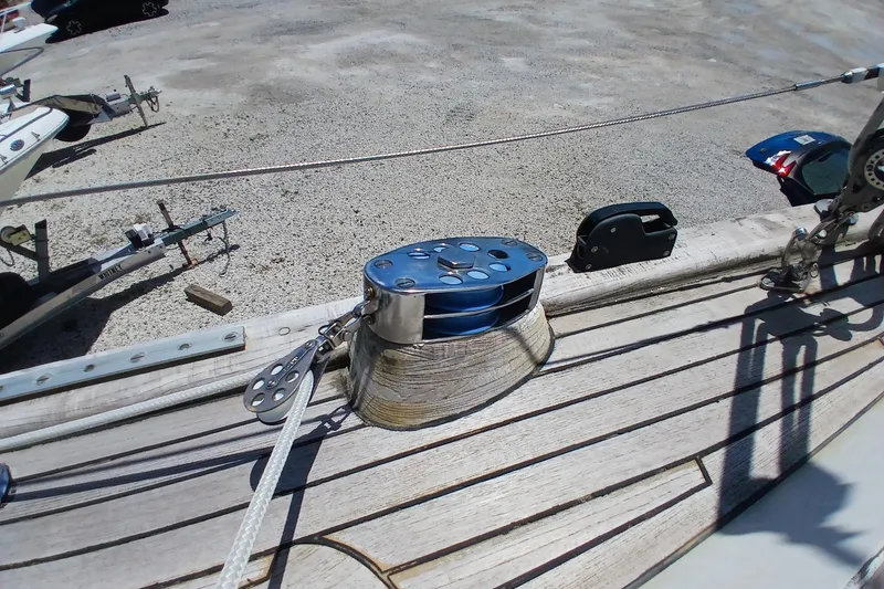Slide: The Image of Deck hardware on 1981 Kaufman Skye 51 sailboat, featuring winch and cleat. - 76