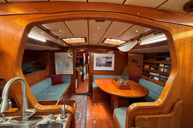Slide: The Image of Interior of 1981 SKYE 51 yacht with wooden furnishings and cozy seating area. - 8