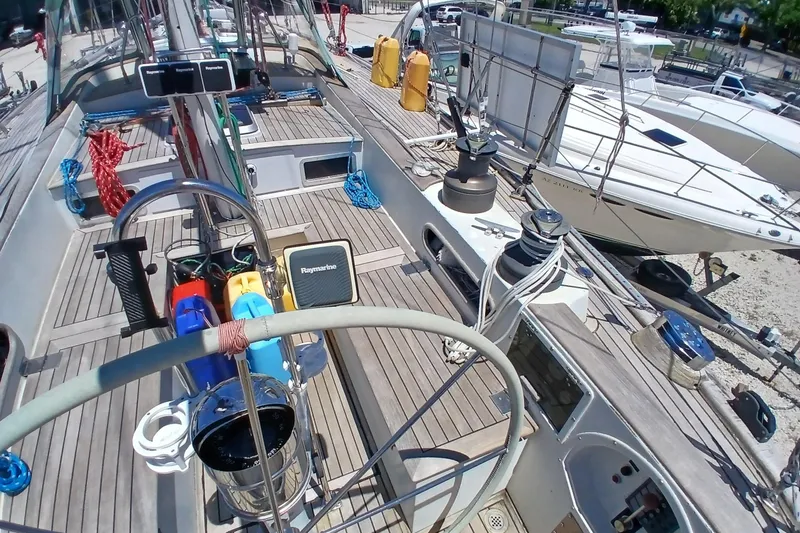 Slide: The Image of 1981 Kaufman Skye 51 sailboat deck with steering wheel and navigation equipment. - 80