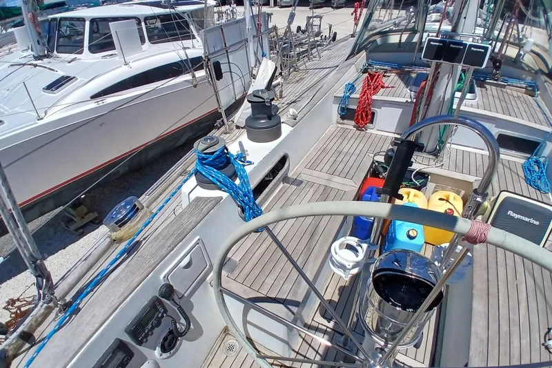 Slide: The Image of Cockpit view of 1981 Kaufman Skye 51 sailboat with nautical equipment and colorful ropes. - 81