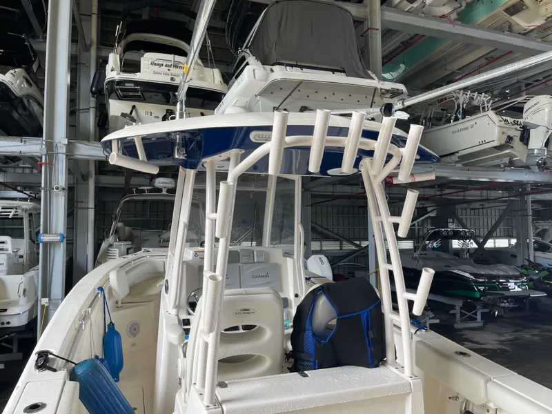 Slide: The Image of 2018 Cobia 301 Center Console boat in storage facility. - 12