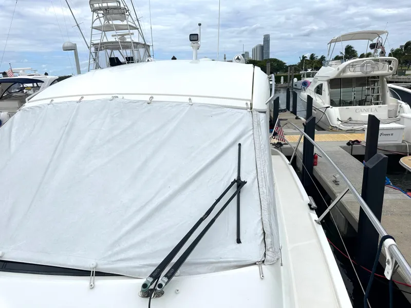 Slide: The Image of 2016 Bavaria Sport 360 HT yacht docked at marina with covered windshield. - 18