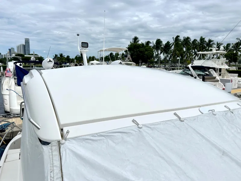 Slide: The Image of Bavaria Sport 360 HT 2016 yacht docked at marina with palm trees in background. - 22