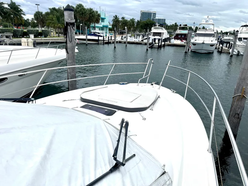 Slide: The Image of Bavaria Sport 360 HT 2016 yacht docked at a marina with other boats. - 23