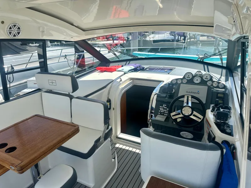 Slide: The Image of Interior of 2016 Bavaria Sport 360 HT yacht with helm and seating area. - 29