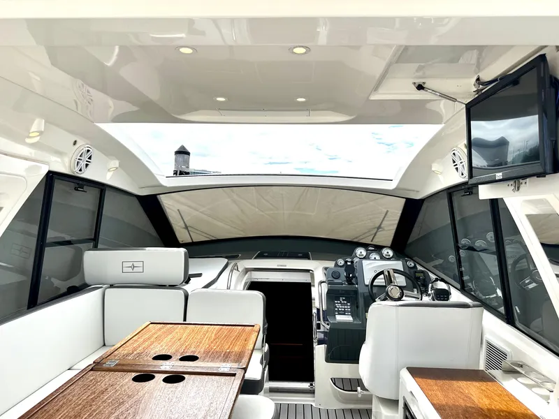 Slide: The Image of Interior of 2016 Bavaria Sport 360 HT yacht with modern helm and seating area. - 30