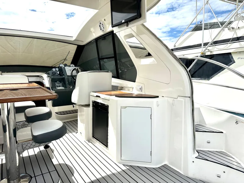 Slide: The Image of Interior of 2016 Bavaria Sport 360 HT yacht with modern amenities and seating. - 32