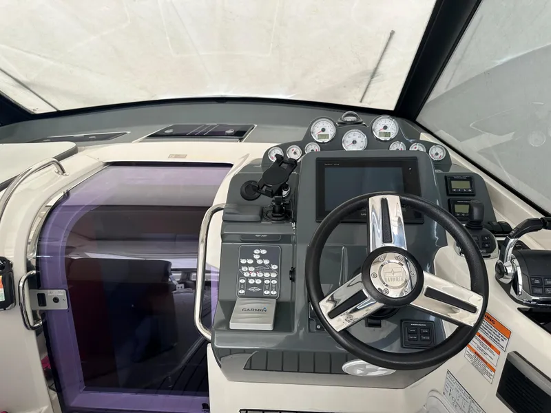 Slide: The Image of 2016 Bavaria Sport 360 HT helm with modern controls and navigation system. - 51