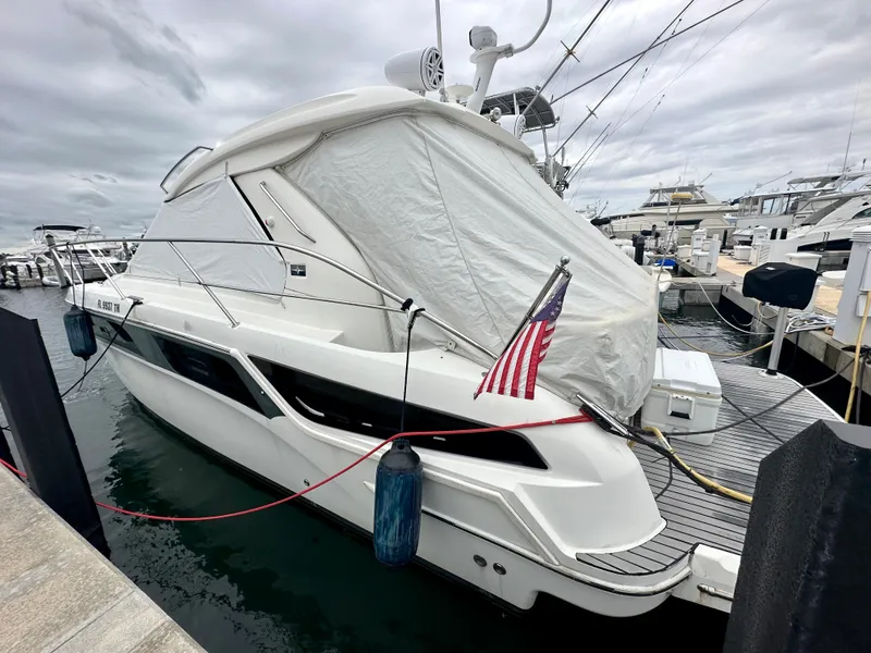 Slide: The Image of 2016 Bavaria Sport 360 HT yacht docked at marina with American flag. - 8