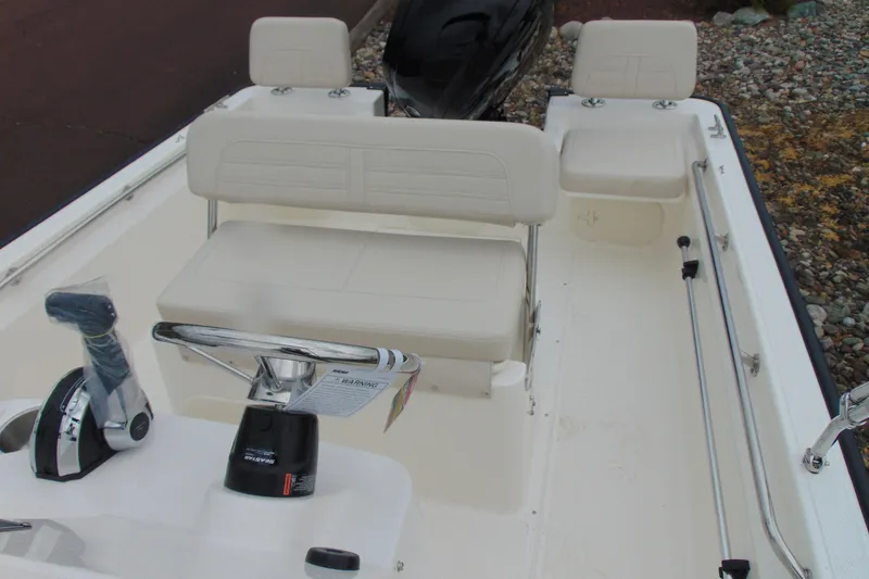 Slide: The Image of 2026 Boston Whaler 170 Montauk boat interior with seating and controls. - 11