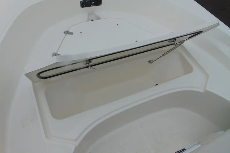 Slide: The Image of Open storage compartment on 2026 Boston Whaler 170 Montauk boat. - 14