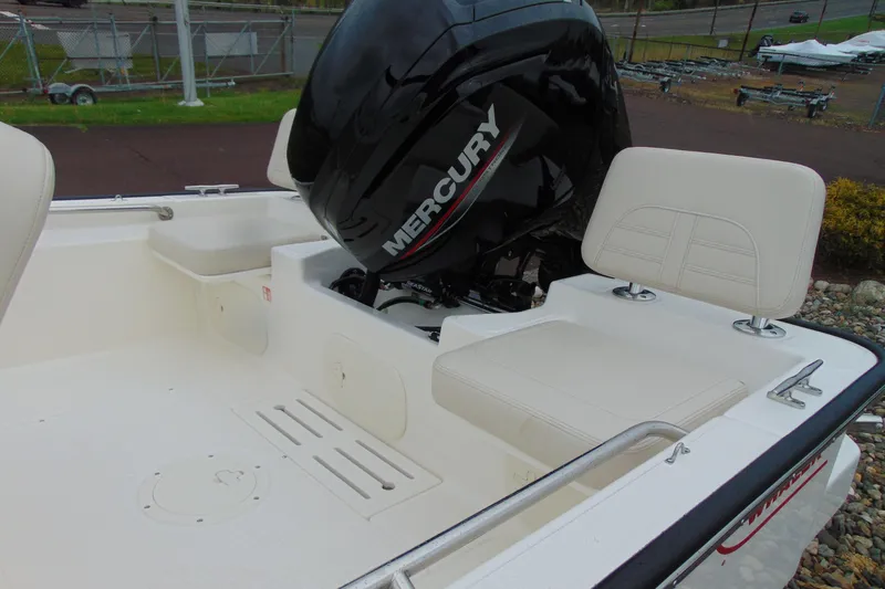 Slide: The Image of 2026 Boston Whaler 170 Montauk boat with Mercury engine, featuring white seating and sleek design. - 5