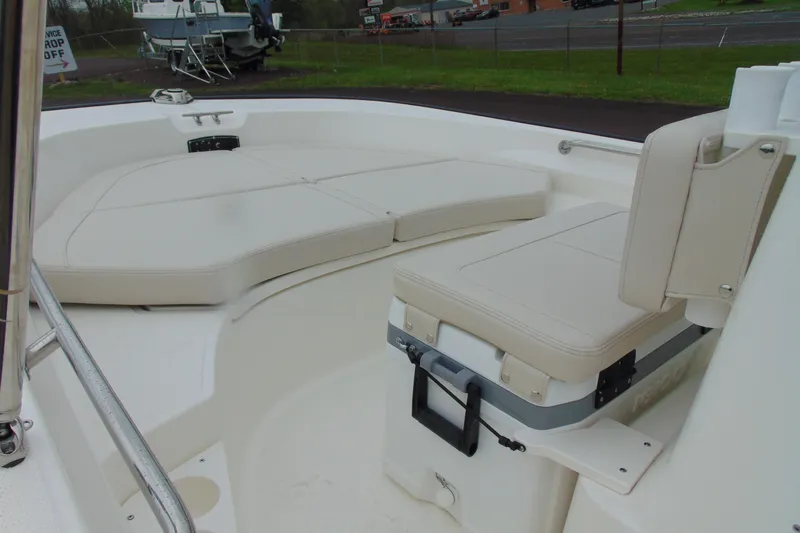 Slide: The Image of 2026 Boston Whaler 170 Montauk boat interior with cushioned seating and storage. - 7